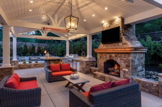 W Series Infratech heater in an outdoor living space with fireplace