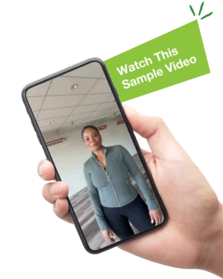 The text "Watch This Sample Video" next to a hand holding a mobile phone with an image of a woman in a yoga studio on the screen
